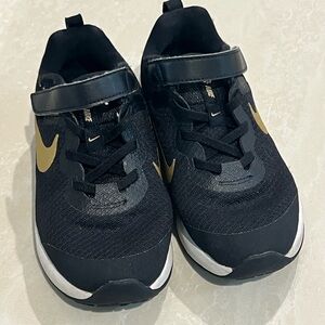 Nike Kids Black Sneakers with Gold Swoosh